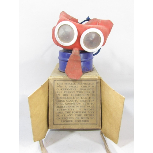 1466 - A Child’s WWII “ Mickey Mouse” Respirator, with its original box and instructions of use and two bra... 