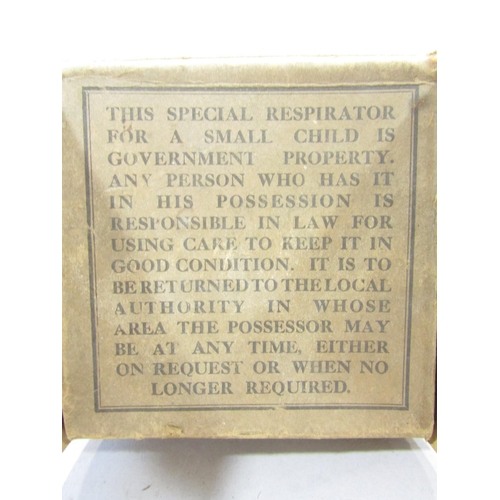 1466 - A Child’s WWII “ Mickey Mouse” Respirator, with its original box and instructions of use and two bra... 
