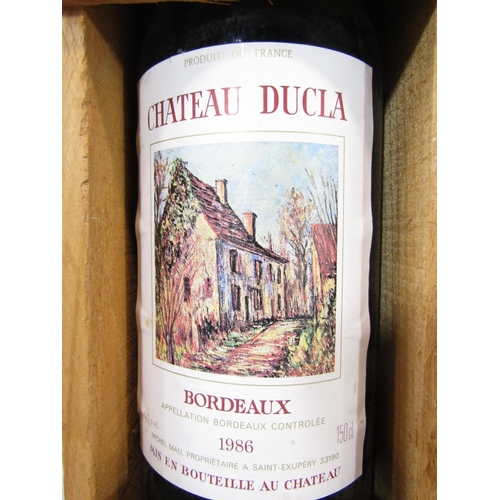 1483 - A magnum of Chateau Dulca Bordeaux red wine, 150cl,  in a wooden presentation box.