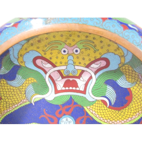 1485 - An early 20th century, Chinese cloisonné bowl with a central angry dragon in bold colours, with furt... 