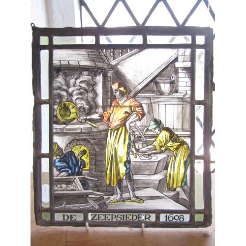 1486 - A leaded stained glass panel “De Zeepsieder 1698” (The Soap Maker) 28cm x 24cm.