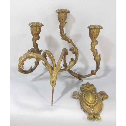 1500 - A pair of 19th century gilt gesso and iron constructed wall candle sconces, in a distressed state an... 