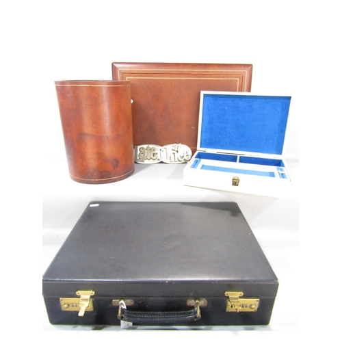 1505 - Leather goods, in the form of a waste paper basket, desk blotter, attaché case and a jewellery box, ... 