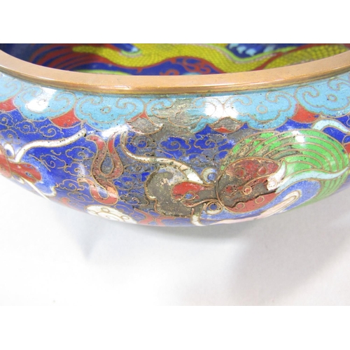 1485 - An early 20th century, Chinese cloisonné bowl with a central angry dragon in bold colours, with furt... 