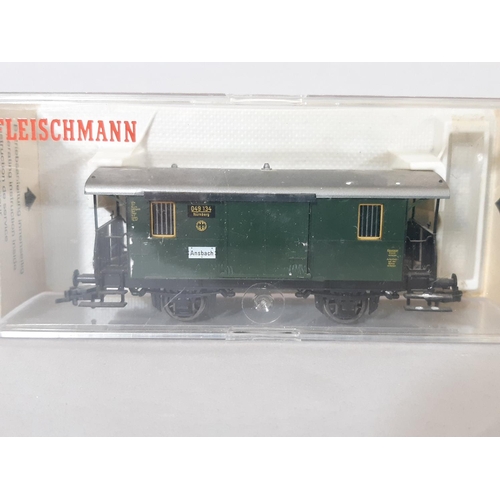 262 - Boxed HO gauge German railway models by Fleishmann comprising 5 passenger cars in DGR green, a packi... 