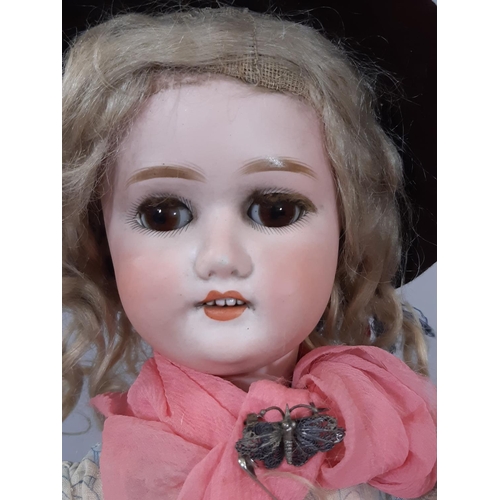 253 - Early 19th century German bisque head doll by Shoenau & Hoffmeister circa 1910 with brown closing ey... 