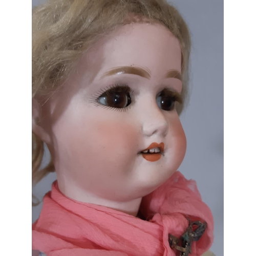 253 - Early 19th century German bisque head doll by Shoenau & Hoffmeister circa 1910 with brown closing ey... 