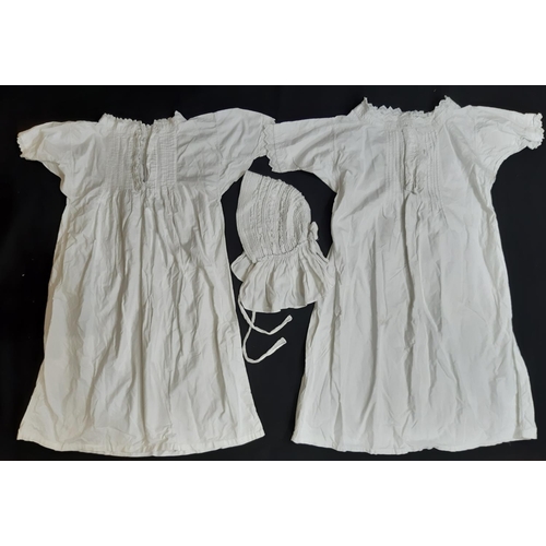 1556 - 2 hand stitched white cotton nightgowns both with short sleeves and embroidered pin tuck front, toge... 