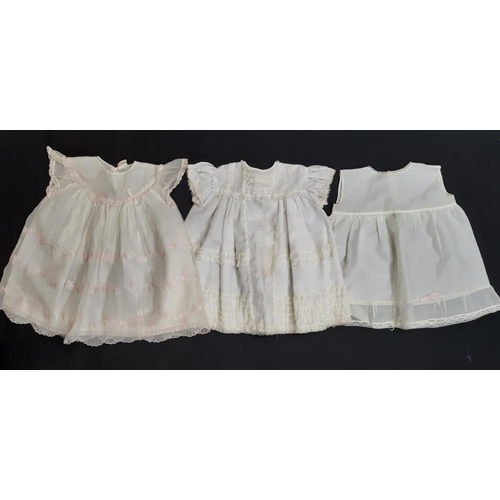 1556 - 2 hand stitched white cotton nightgowns both with short sleeves and embroidered pin tuck front, toge... 