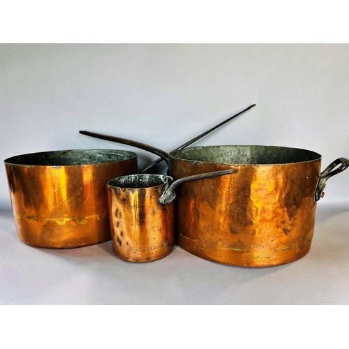 1510 - Three 19th century copper saucepans with cast iron handles and with old repairs, 31cm diam, 28.5cm d... 