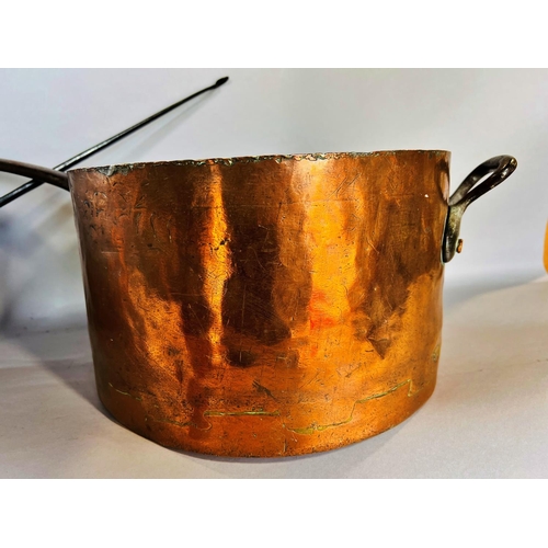 1510 - Three 19th century copper saucepans with cast iron handles and with old repairs, 31cm diam, 28.5cm d... 