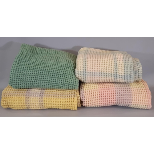 1553 - 4 vintage woollen waffle blankets comprising a green/yellow blanket 1.6x1.8m, a yellow/ white/ mauve... 