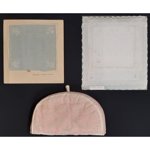 1558 - Exhibition lacework pieces; a handmade tea cosy (1960's) in counted thread lacework with pink lining... 