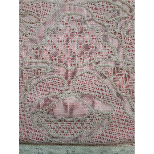 1558 - Exhibition lacework pieces; a handmade tea cosy (1960's) in counted thread lacework with pink lining... 