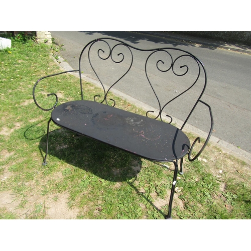 2002 - A light steel two seat garden bench with simple open scrollwork detail, 107 cm wide