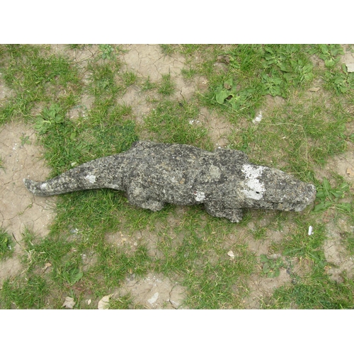 2003 - A weathered cast composition stone garden ornament in the form of an alligator 80 cm long approximat... 