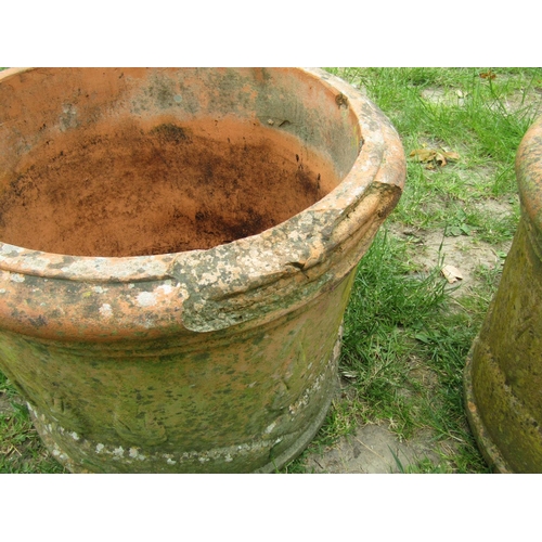 2004 - A pair of weathered squat cylindrical terracotta planters with repeating tree and rolling landscape ... 