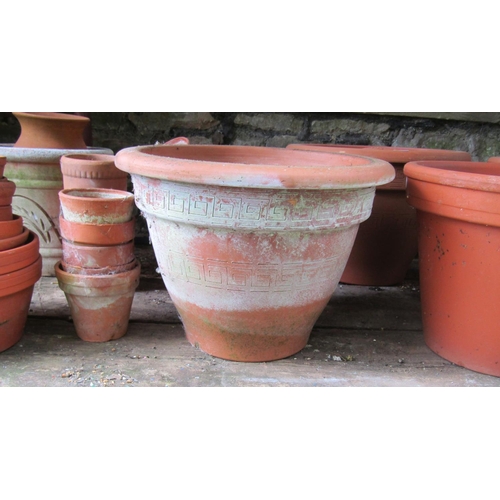 2008 - A quantity of terracotta flower pots of varying size and design, some with incised detail, the large... 