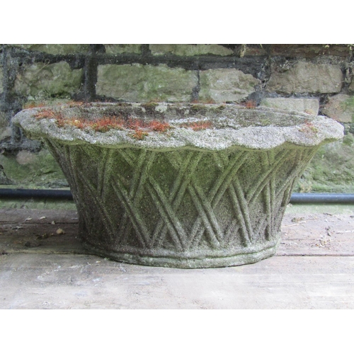 2009 - A weathered cast composition stone planter in the form of an oval lattice basket 51 cm x 40 cm x 21 ... 