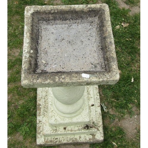 2012 - A painted and weathered two sectional bird bath with square top raised on a baluster pedestal with s... 