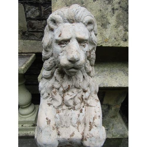 2013 - A painted and weathered cast composition stone garden/pier ornament in the form of a lion clutching ... 