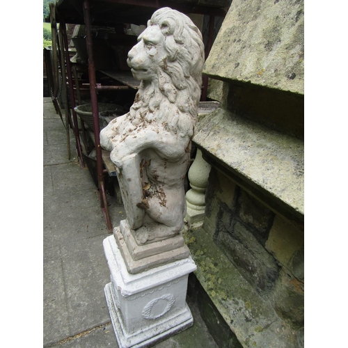 2013 - A painted and weathered cast composition stone garden/pier ornament in the form of a lion clutching ... 