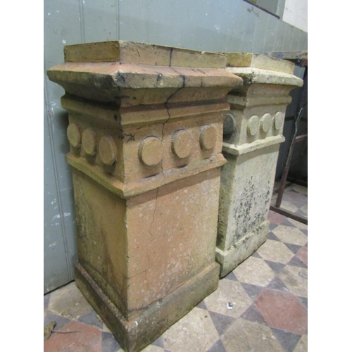 2016 - A pair of weathered buff coloured chimney pots with unusual repeating disc collars (probably Doulton... 