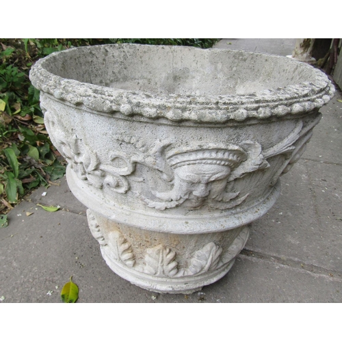 2031 - Three weathered cast composition stone garden planters of varying size and design, one example in th... 