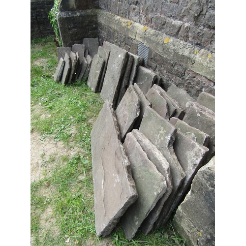 2051 - An area of approximately ten square meters of natural stone flagstones of varying size and thickness