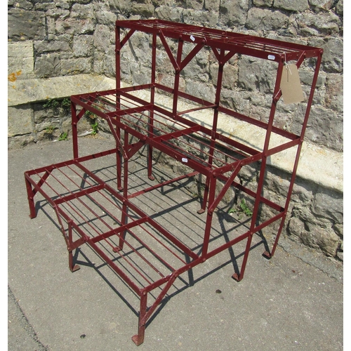 2053 - A painted strapwork plant stand on three stepped tiers 91 cm wide x 75 cm deep x  90 cm high