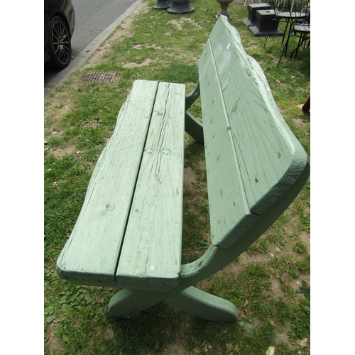 2058 - A light green painted rustic wooden bench raised on x framed supports, 140 cm wide