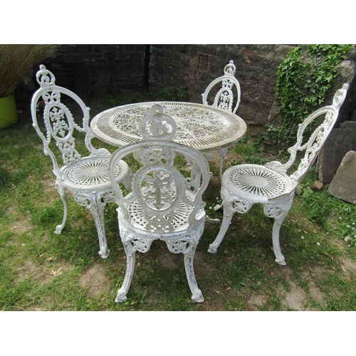 2059 - A cream painted cast aluminium garden terrace table with decorative circular pierced top 80 cm diame... 