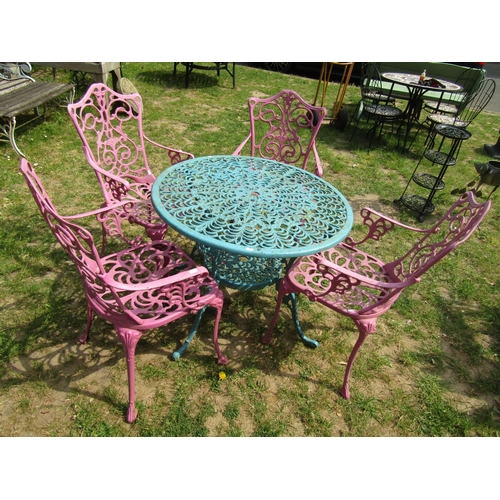 2060 - A cast aluminium garden terrace table with decorative pierced circular top 86 cm diameter together w... 