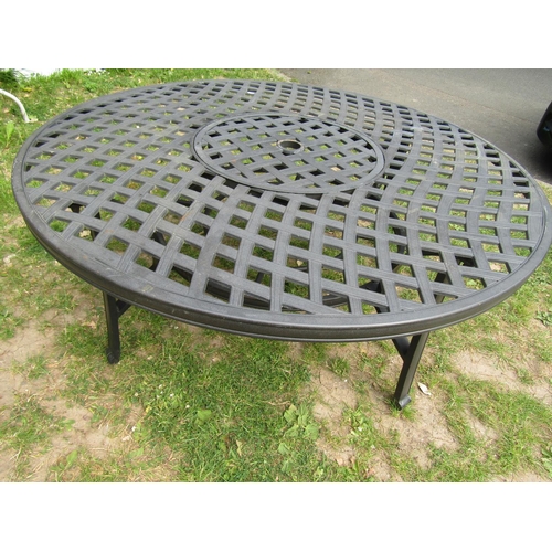 2061 - A low contemporary circular garden table with pierced lattice top 132 cm diameter x 53 cm high