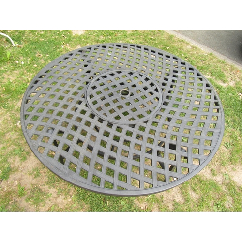 2061 - A low contemporary circular garden table with pierced lattice top 132 cm diameter x 53 cm high