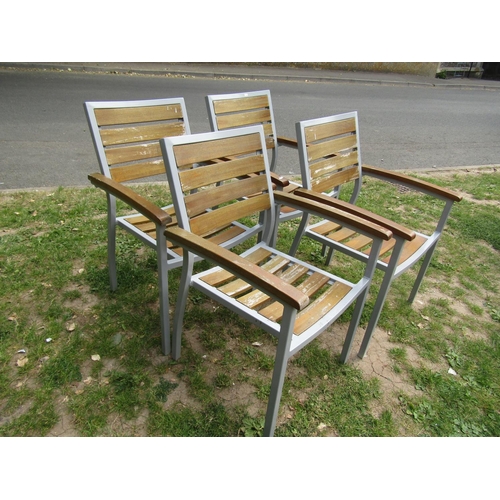 2063 - A set of four weathered contemporary garden terrace chairs capable to stack