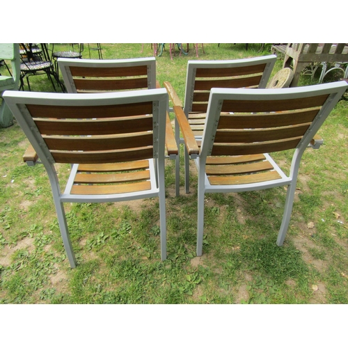 2063 - A set of four weathered contemporary garden terrace chairs capable to stack