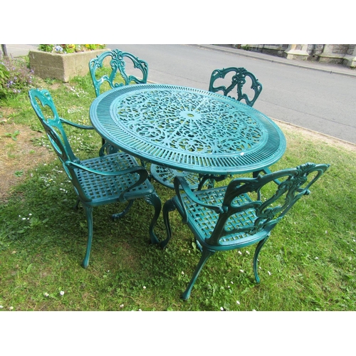 2065 - A green  painted cast aluminium garden terrace table of circular form with decorative pierced top, 1... 