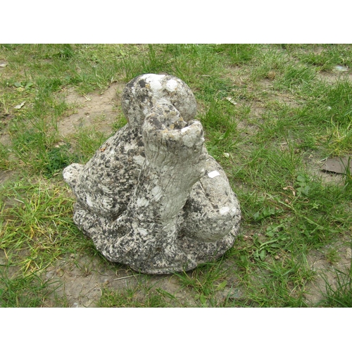 2093 - A well weathered cast composition stone garden ornament in the form of a family of ducks beside a tr... 