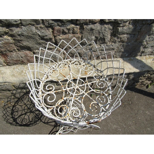 2094 - A vintage wirework plant stand raised on scrolled supports, 84 cm high