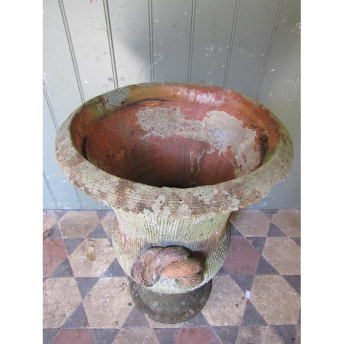 2095 - An old weathered terracotta garden urn with flared rim and textured combed finish, 40 cm diameter x ... 