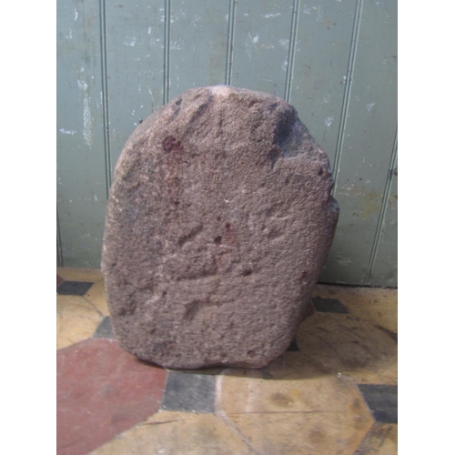 2113 - An old carved and weathered stone naive head, 33 cm high