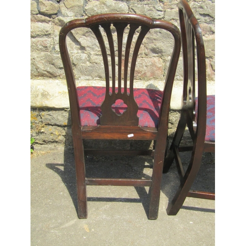 2172 - A set of four Georgian style mahogany comb back dining chairs with pierced quatrefoil splats over dr... 