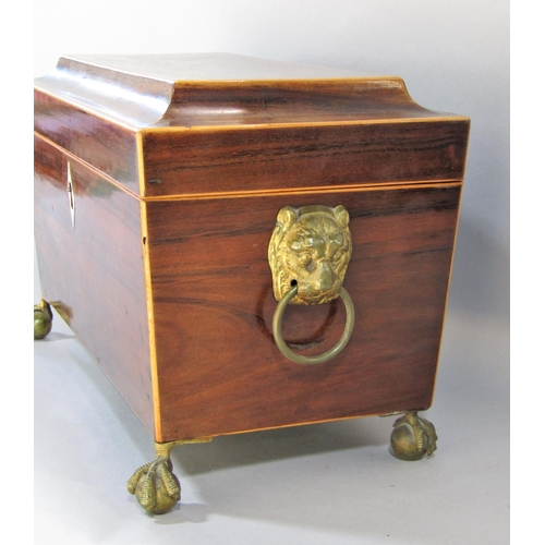 1481 - A Regency mahogany sarcophagus shaped tea caddy, with satin wood stringing with two lined caddies an... 