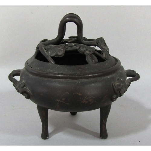 1518 - A small bronze koro with prunus flower cover and handles raised on three slender supports, 13cm x 11... 