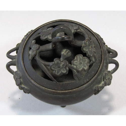 1518 - A small bronze koro with prunus flower cover and handles raised on three slender supports, 13cm x 11... 