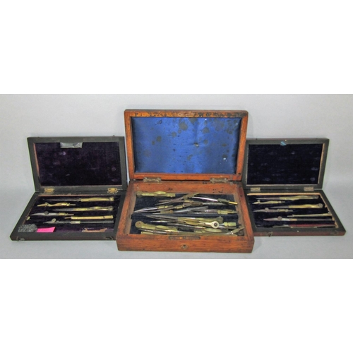 1522B - A collection of vintage draughtsman’s drawing instruments some complete sets in their original mahog... 