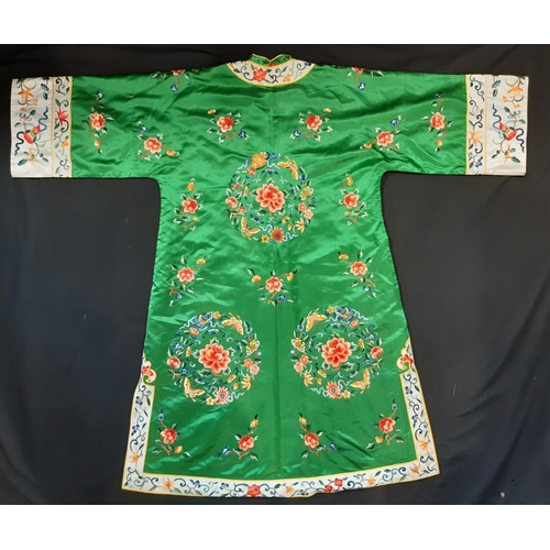 1546 - Kimono in green silk satin embroidered with flower and moth roundels and with simple frog front fast... 