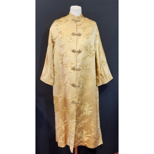 1548 - Vintage kimono in gold patterned silk with frog fasteners and quilted mandarin collar and cuffs. Bac... 