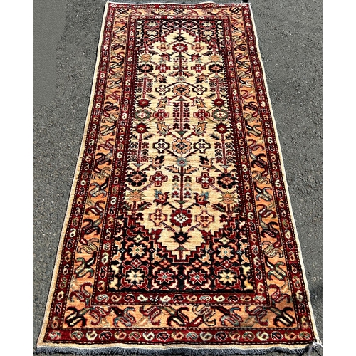 1593 - An ivory ground Afghan runner of Hamadan design, 192cm x 85cm